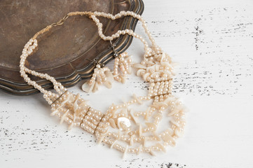 Fototapeta premium Vintage necklace and earrings in metal plate