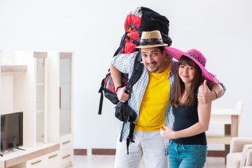 Young active pair preparing for honeymoon trip