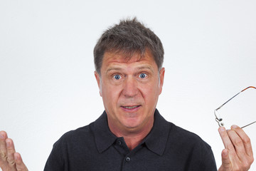 portrait of astonished senior man in studio
