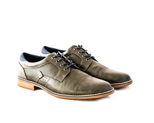Studio shot top view brand new a pair set grey men dress shoes isolated on white background. Formal...