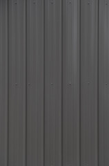 A Background of Dark Brown Metal Siding on a Building