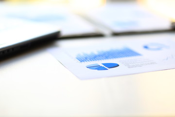 business background: financial statistics,notebook and pen on office workplace