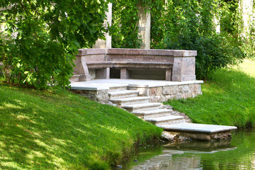 Fototapeta premium stone stairs leading to the water in the park