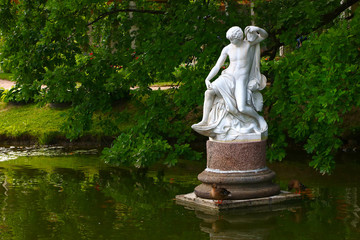 ancient sculptures in the summer park