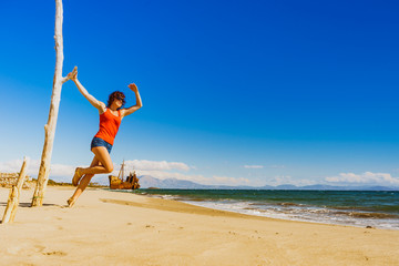 Tourist woman on beach enjoying vacation