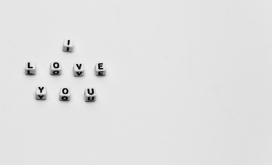 Message I love you spelled in  dice with copy space