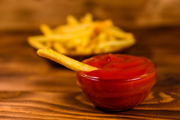 Fresh french fry dipped into the tomato sauce