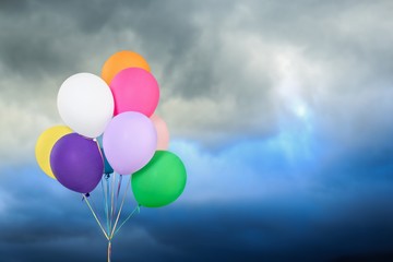Bunch of colorful balloons on sky background