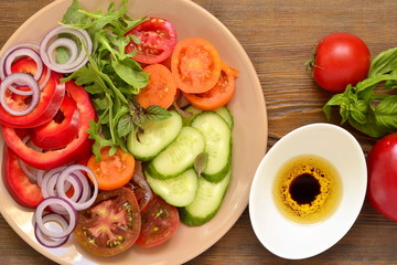 Colorful summer salad with fresh vegetables,  top view 