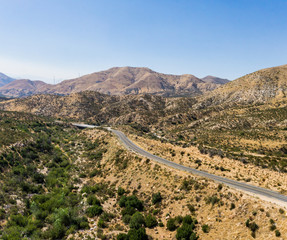 Narrow Road in Arid Desert