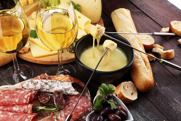 Gourmet Swiss fondue dinner on a winter evening with assorted cheese