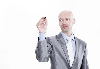 serious businessman pointing a marker at the virtual point.i