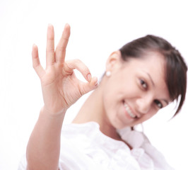 closeup.successful young woman showing the sign OK