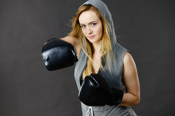 Boxer girl exercise with boxing gloves.