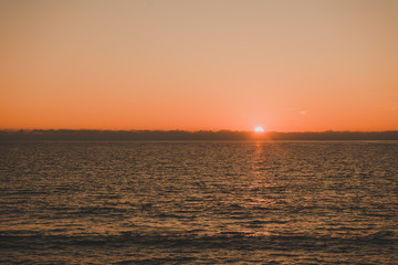 Fototapeta premium Sunset or sunrise over sea surface