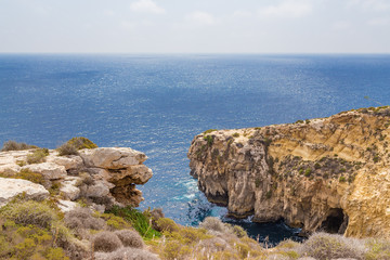 Fototapeta na wymiar Wied Iz-Zurrieq, Malta. Sea and mountains