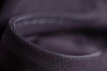 Black fabric material texture macro zipper blur background