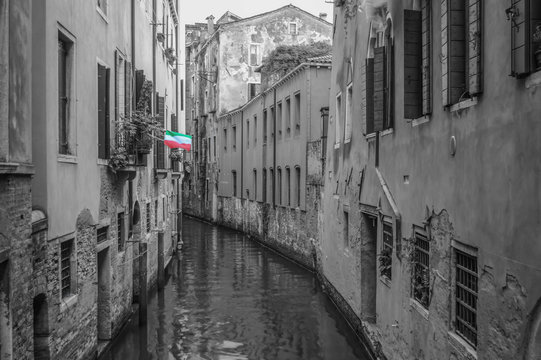 Monochrome Venice canal photograph with bright vivid tricolore italy flag