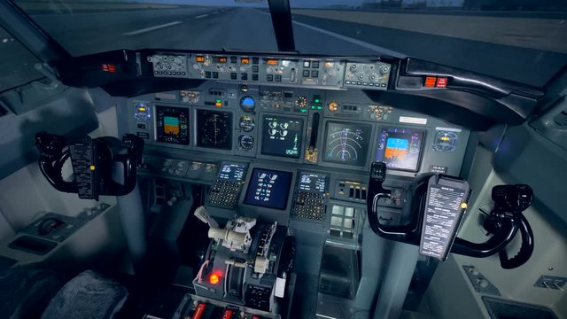 Interior of a functioning cockpit of an airplane. Empty cockpit of an airplane. 4K.