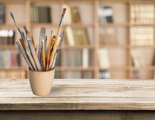 Brushes in a glass jar
