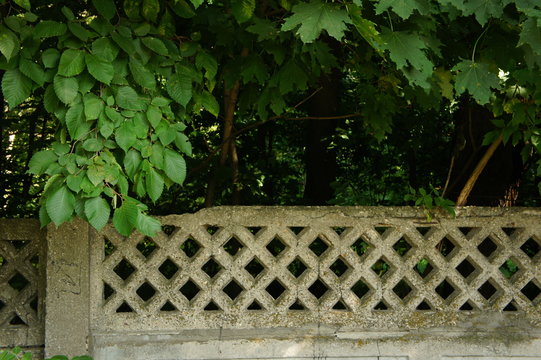 Fence with a stone lattice.