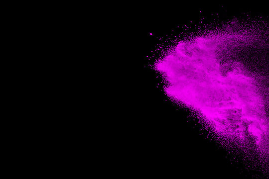 Abstract purple powder explosion on black background, Freeze motion of purple dust splashing.