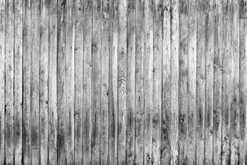 Old fence from wooden boards,wooden background, black and white texture