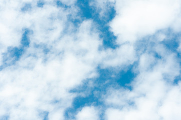Blue sky with fluffy cloud, sky background.