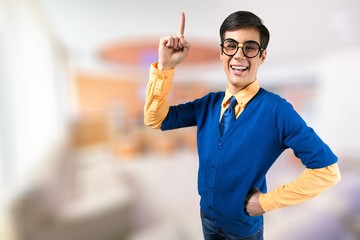 Young nerd man posing on background