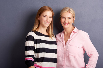 Beautiful mother and daughter studio shot