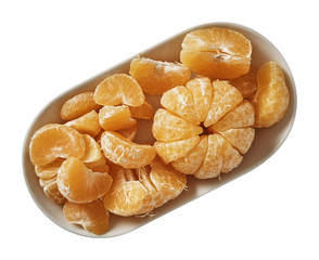 Tangerine on plate. Preparing ingredients for cooking. Isolated on white background. Top view.