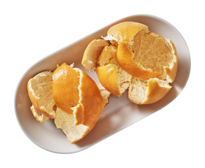 Tangerine on plate. Preparing ingredients for cooking. Isolated on white background. Top view.