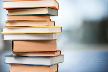 Books collection in pile on  background.