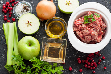 Ingredients for ground meat stewed with berries and herbs