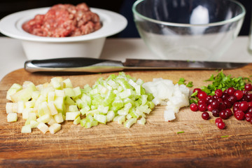 Preparation of ground meat stewed with berries and herbs