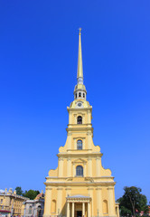 Peter and Paul Cathedral at Peter and Paul Fortress in Saint Petersburg, Russia. Bell Tower of Christian Church, Religious Building Architecture Details. Church Tower View on Clear Blue Sky Background