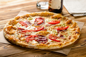 great tasty Italian pizza on wooden desk