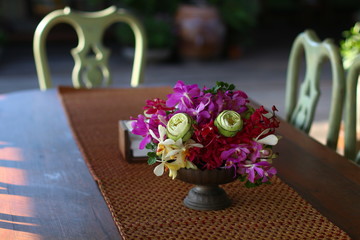 Flowers centerpiece with mat and two chair