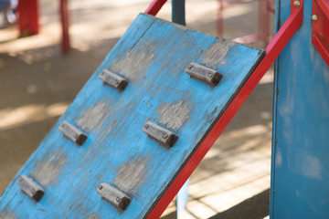 old Wooden wall for climbing close up. Sports extreme blue and grey background