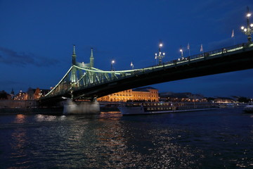 Fototapeta premium Panoramic views of night bridges through Danube with illumination.