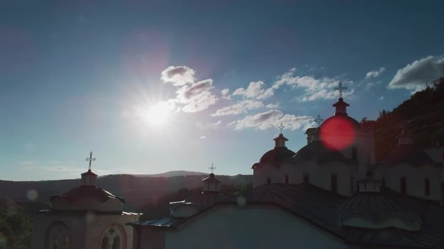 Timelapse of the sun setting over an orthodox church