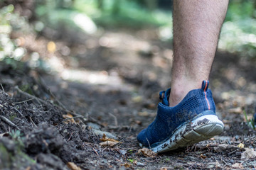 Man running on a dirt (mud) path (Zlaca, Bosnia)