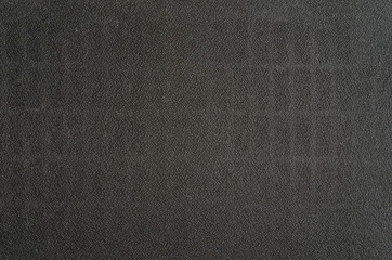 Fototapeta na wymiar Protective black mesh fabric texture of loudspeaker