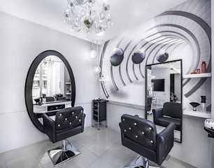 Modern bright beauty salon or baber shop. Hair salon interior business with black and white luxury decor.