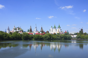 Izmailovo Kremlin near the lake with green trees and blue sky. Moscow, Russia