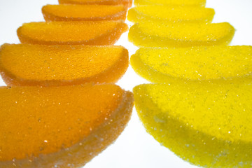 Fototapeta na wymiar multicolored figurines from marmalade on a white background
