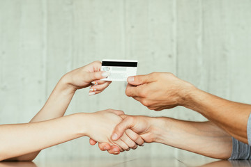 online money loan. financial operations on the internet. handshake after deal closure and electronic transfer using credit or debit bank card