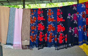 UGLICH, RUSSIA. Pavlovo Posad shawls are on sale at a fair of folk art