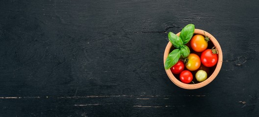 Cherry tomatoes. Top view. On the table. Free space for text.