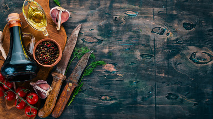 Food Background. Cherry tomatoes, spices and sauces. Top view. On a wooden background. Free space for text.